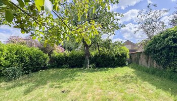 Bien polyvalent avec grand espace habitable et jardin ensoleillé