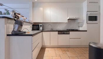 Ruim en breed 2SLK-appartement met zijdelings zeezicht vlakbij het Rubensplein