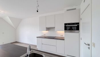 Instapklaar appartement met 2 slaapkamers & inpandige garage