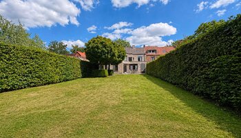 Veelzijdige gezinswoning met praktijkruimte en zonnige tuin